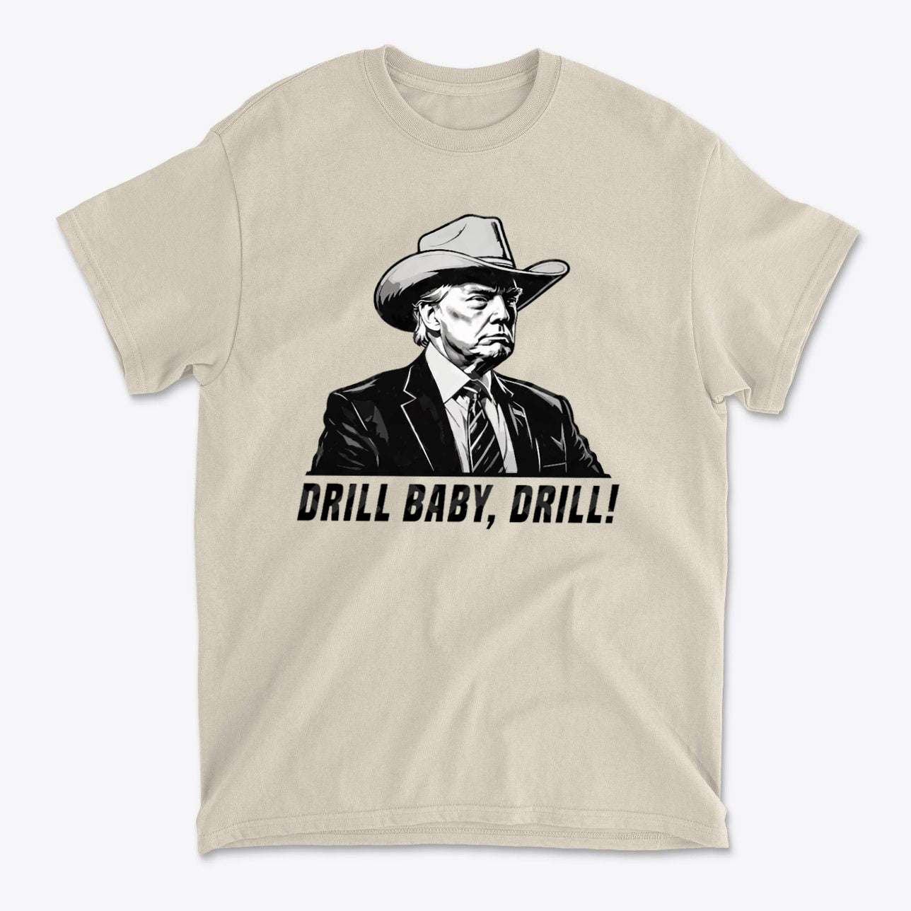 Drill Baby Drill Patriotic Graphic Tee featuring a bold and iconic slogan on a light beige shirt.