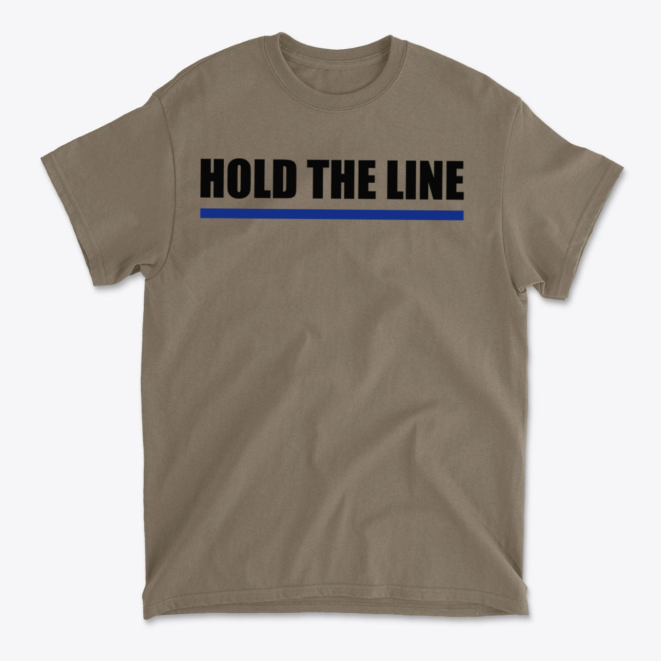 Hold The Line Black Letters T Shirt with bold text and blue accent on a tan background.