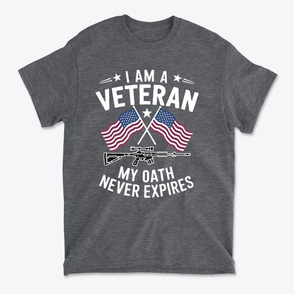 I Am A Veteran My Oath Never Expires t-shirt featuring American flags and a rifle design on a gray shirt.