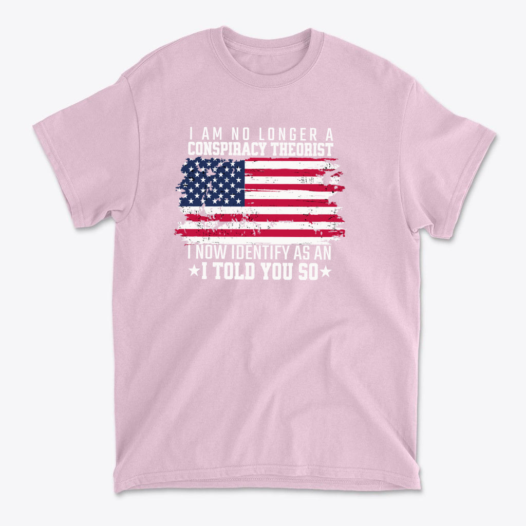 I Am No Longer A Conspiracy Theorist graphic t-shirt design with American flag and bold text statement.