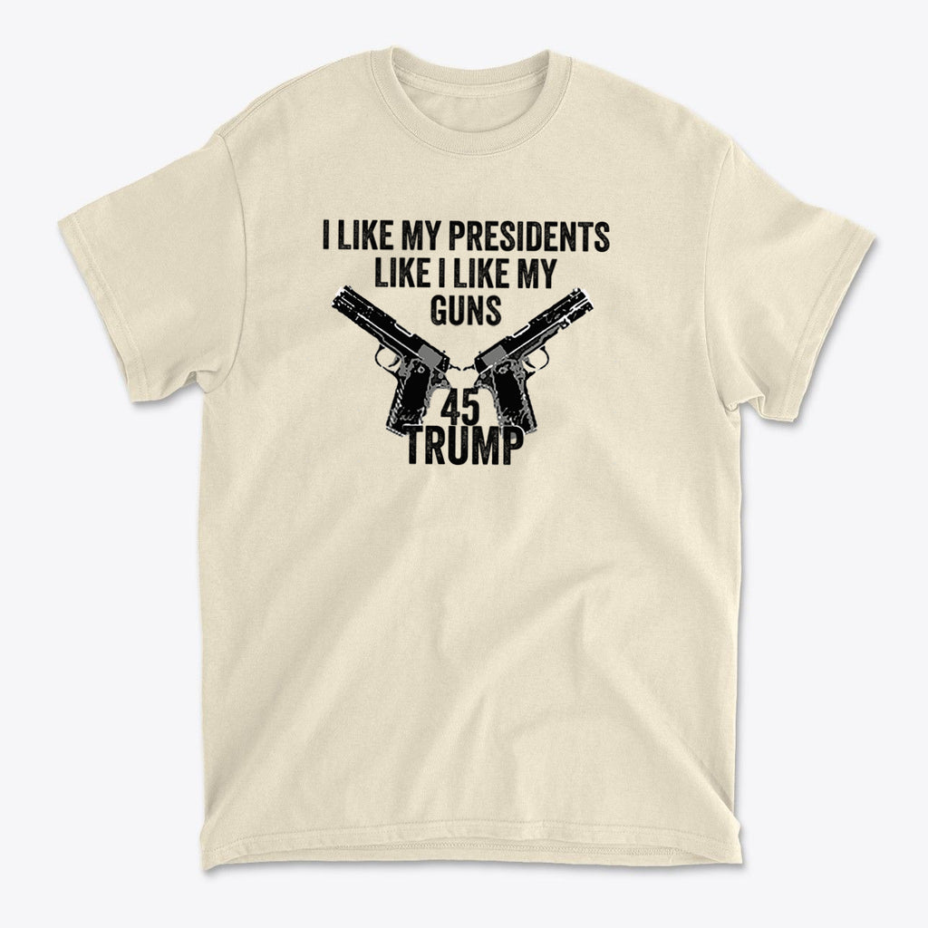 I Like My Presidents Like I Like My Guns 45 Trump graphic on a beige t-shirt with gun illustrations.