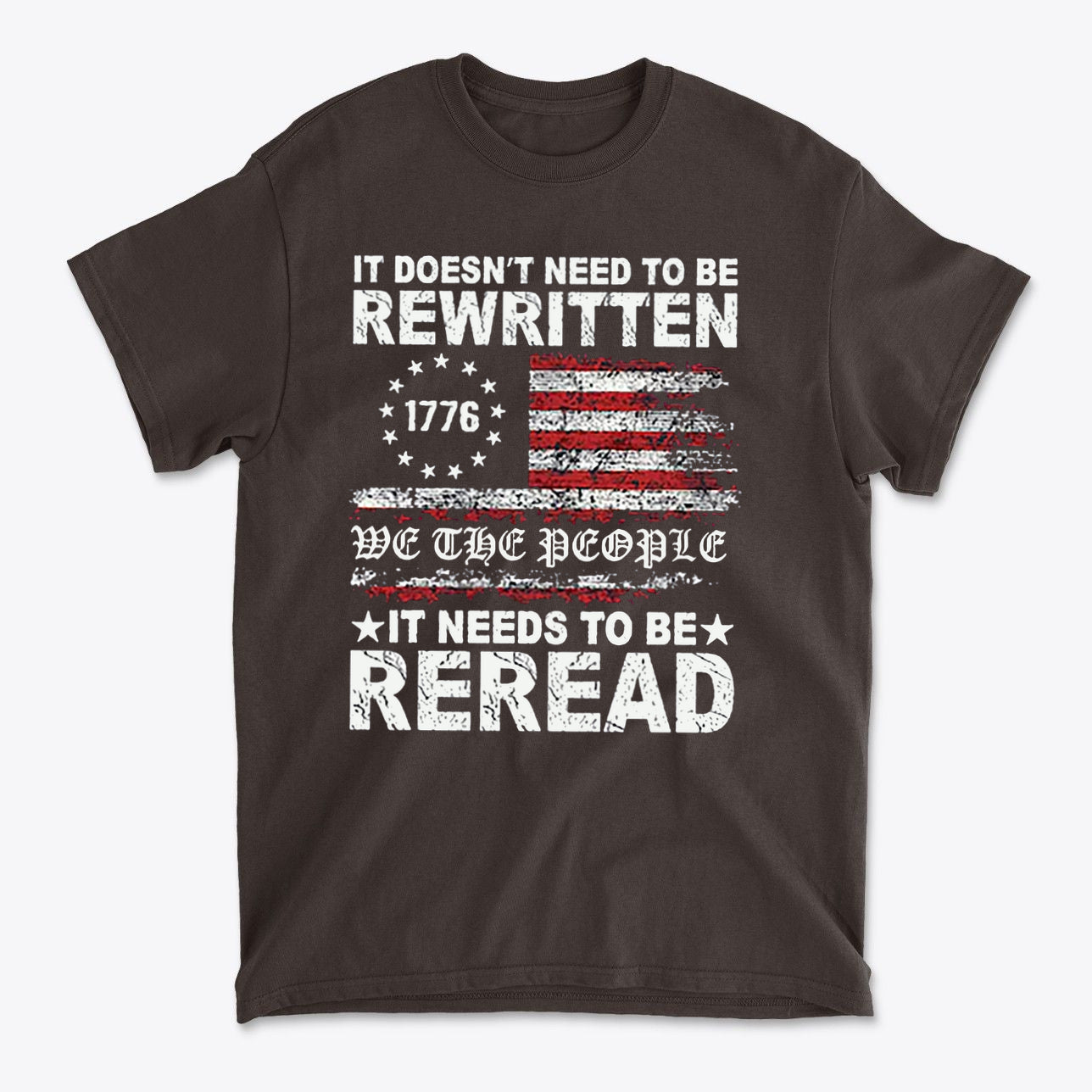 It Needs to Be Reread Patriotic Design t-shirt featuring a vintage American flag and bold text statement.