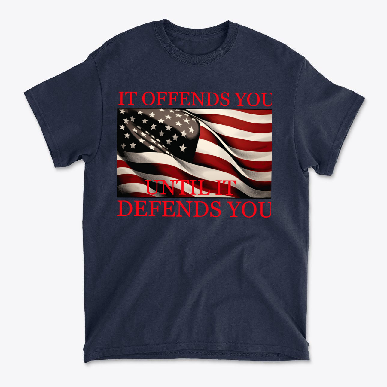If Offends You Until It Defends You graphic tee featuring a waving American flag and bold text.