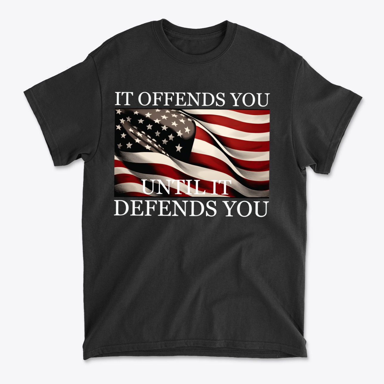 It Offends You Until It Defends You Wht Ltrs black t-shirt featuring American flag design and bold lettering.