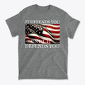 It Offends You Until It Defends You Wht Ltrs graphic t-shirt with American flag design.