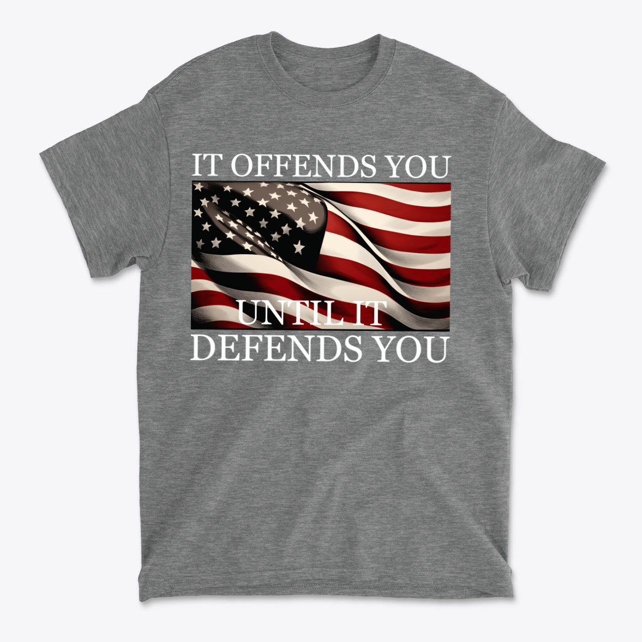It Offends You Until It Defends You Wht Ltrs graphic t-shirt with American flag design.