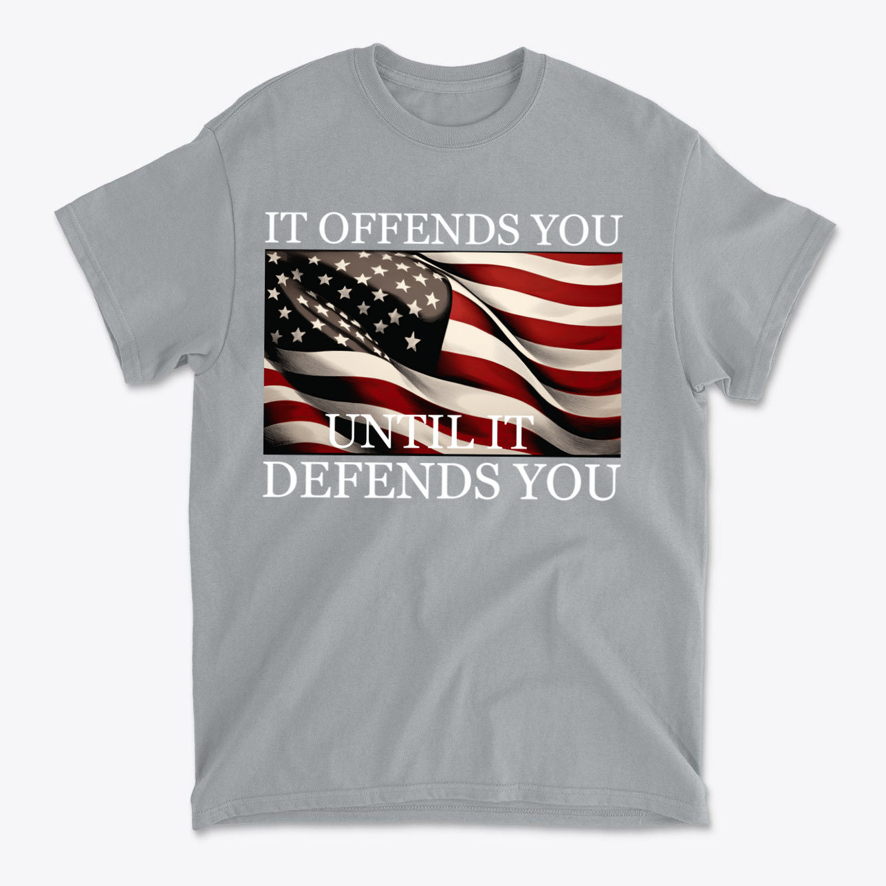 It Offends You Until It Defends You Wht Ltrs gray t-shirt featuring an American flag design.