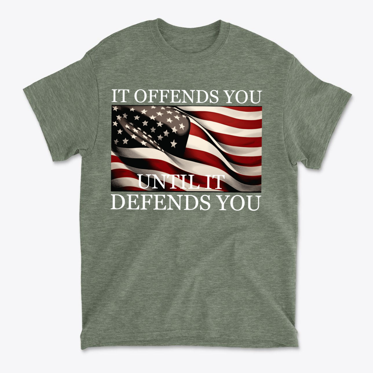 It Offends You Until It Defends You Wht Ltrs shirt featuring American flag design on green background.
