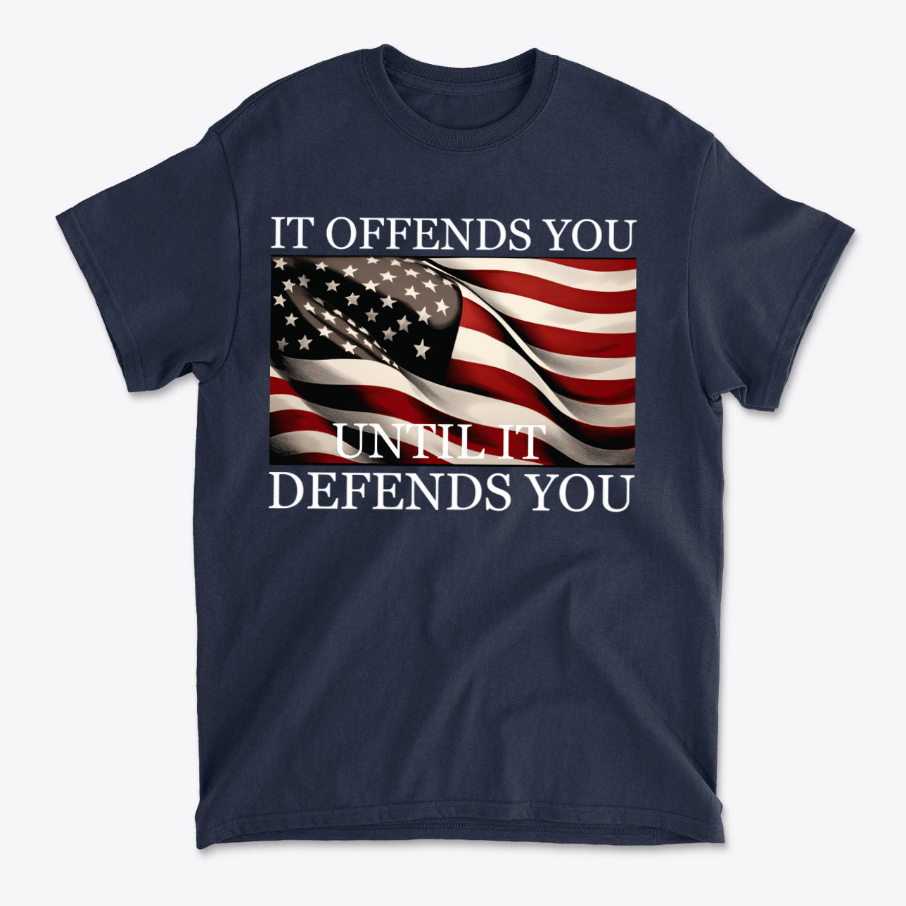 It Offends You Until It Defends You Wht Ltrs t-shirt featuring American flag design.