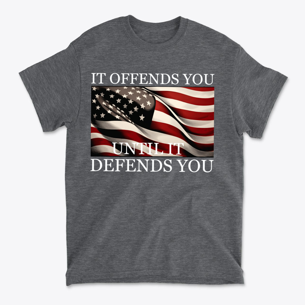 It Offends You Until It Defends You Wht Ltrs graphic t-shirt featuring American flag design.