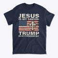 T-shirt featuring text 'Jesus Is My Savior Trump Is My President' with a patriotic design and cross.