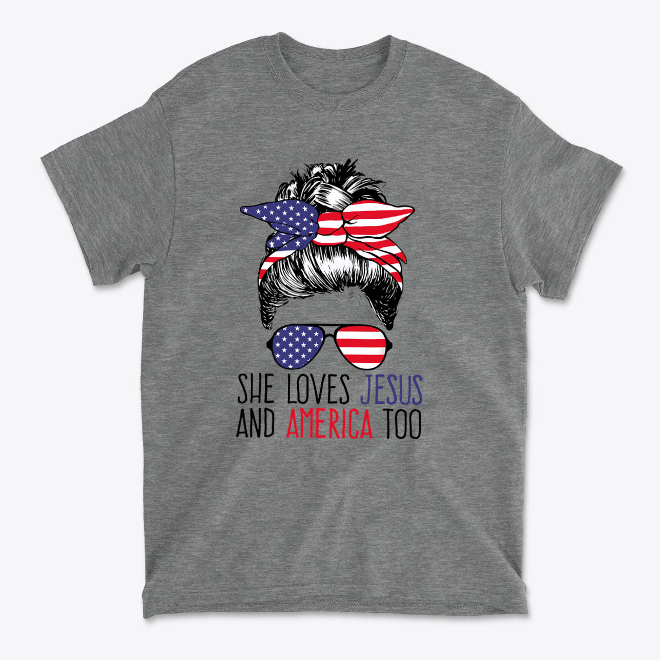 Graphic tee with the phrase 'She Loves Jesus And America Too' and a hair design featuring patriotic colors.