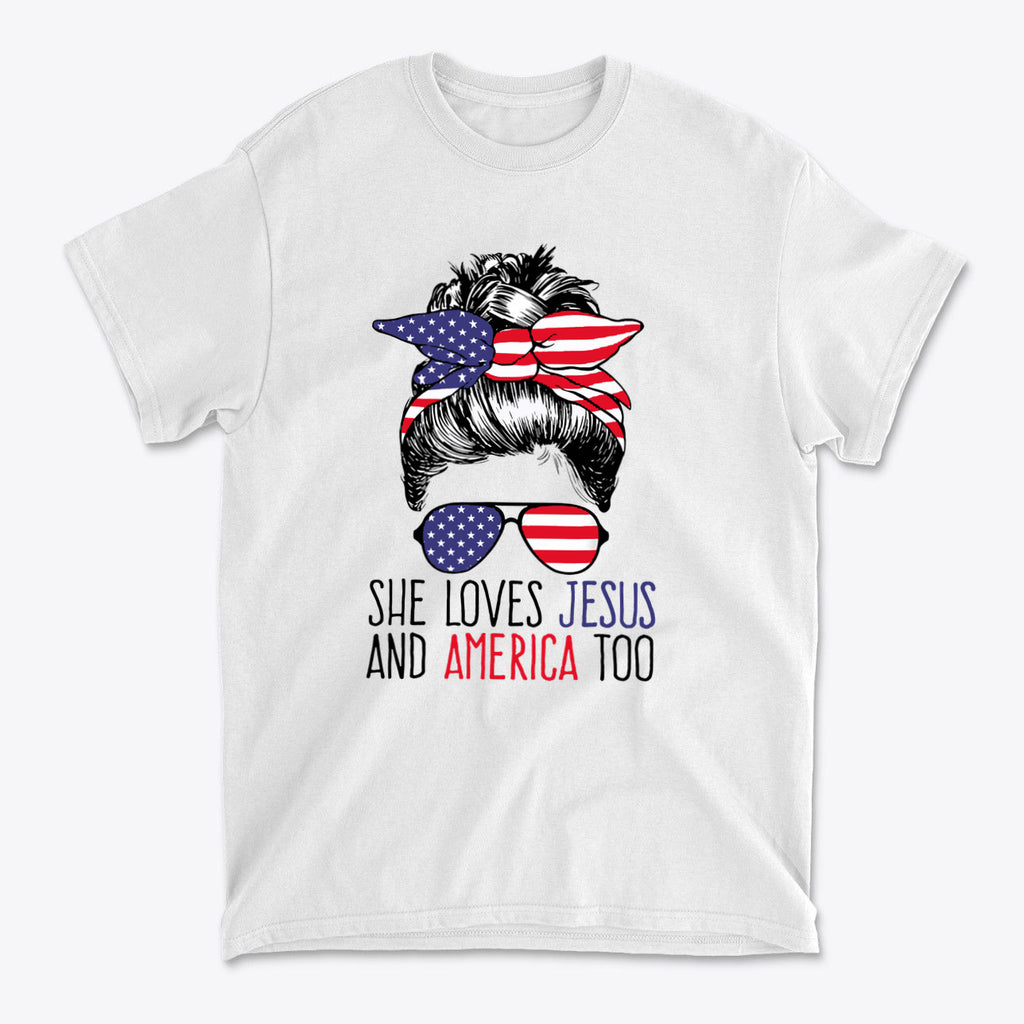 She Loves Jesus And America Too graphic t-shirt featuring patriotic design with sunglasses and hair bun style.