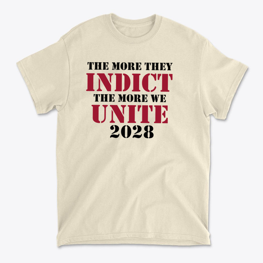 The More They Indict The More We Unite 2028 Blk Ltrs t-shirt featuring bold text on a cream background.