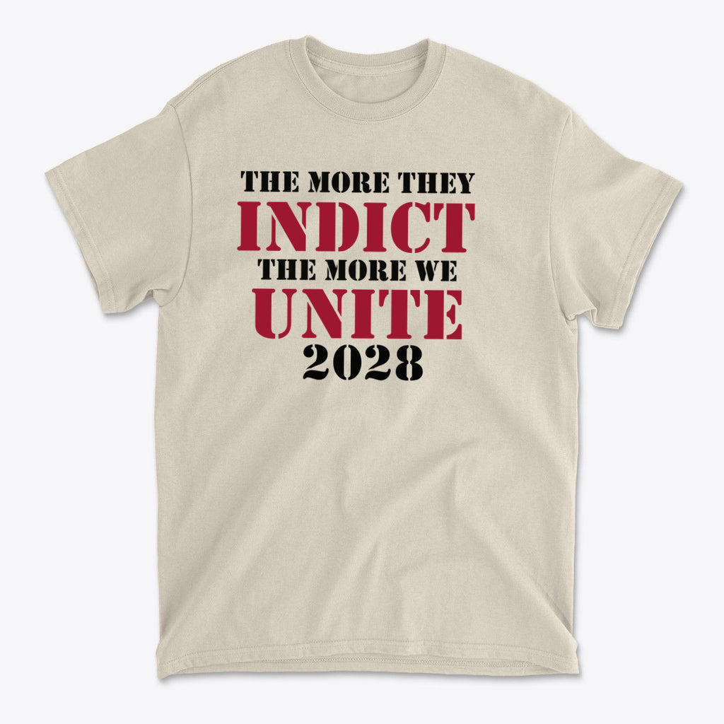 The More They Indict The More We Unite 2028 Blk Ltrs printed on a beige t-shirt, bold campaign statement.