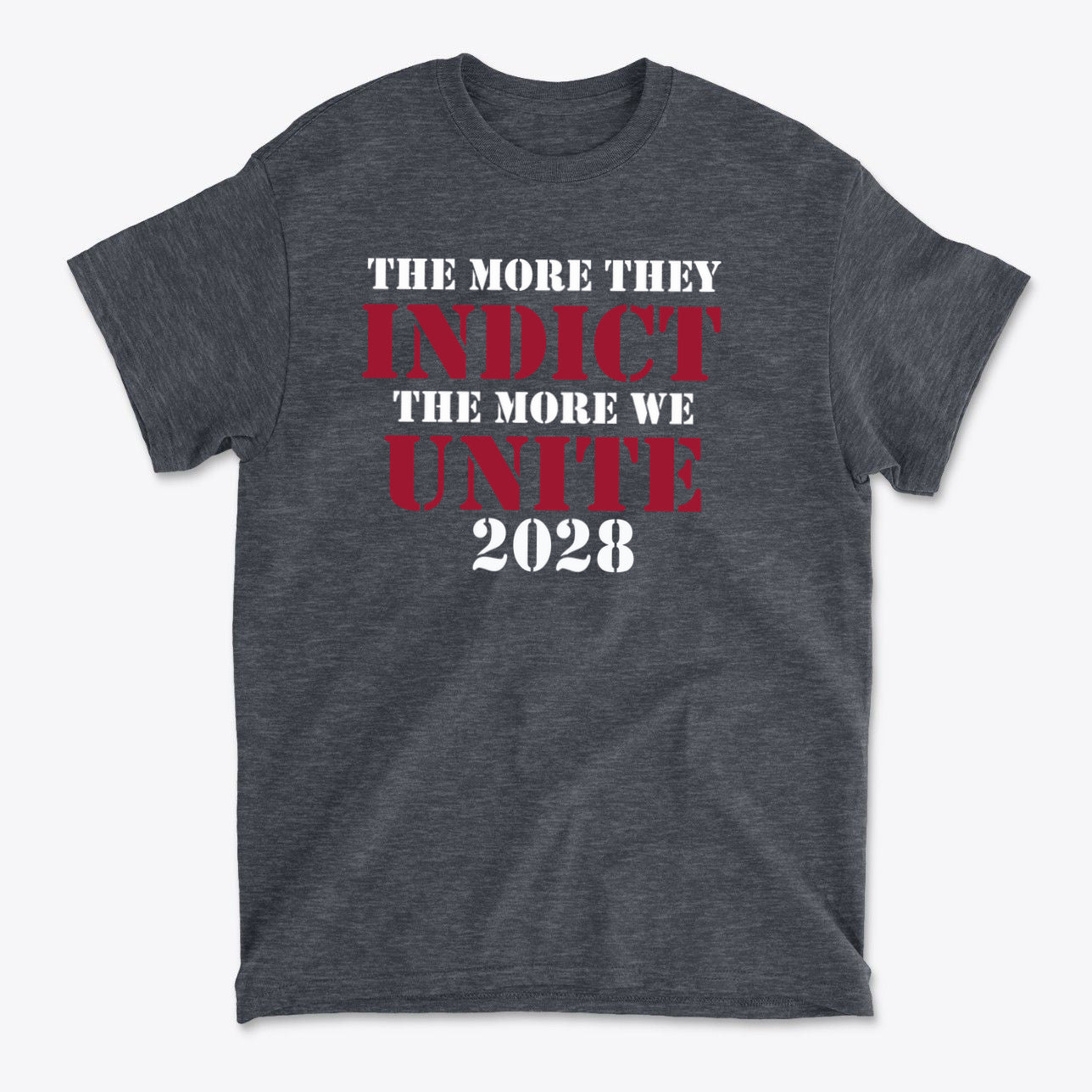 The More They Indict The More We Unite 2028 Wht Ltrs on a stylish dark gray t-shirt showcasing political solidarity.