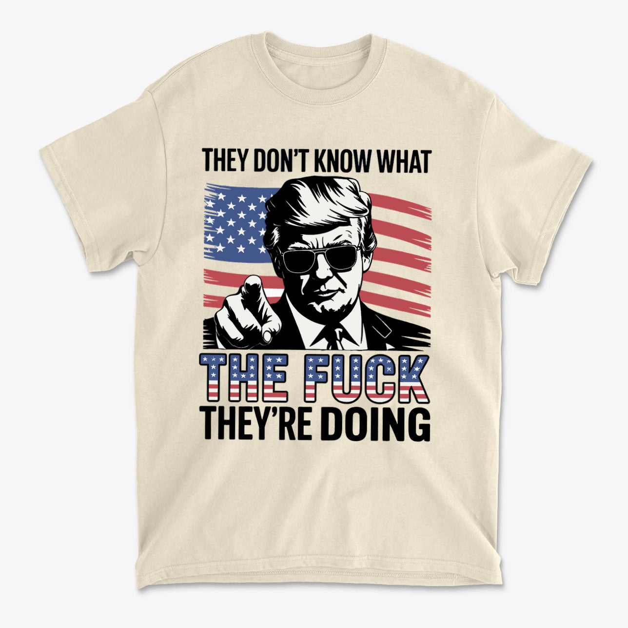 T-shirt featuring the quote 'They Don't Know What The Fuck They're Doing' with an American flag backdrop.