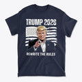 Trump 2028 On American Flag Rewrite The Rules apparel featuring Trump pointing with patriotic background.