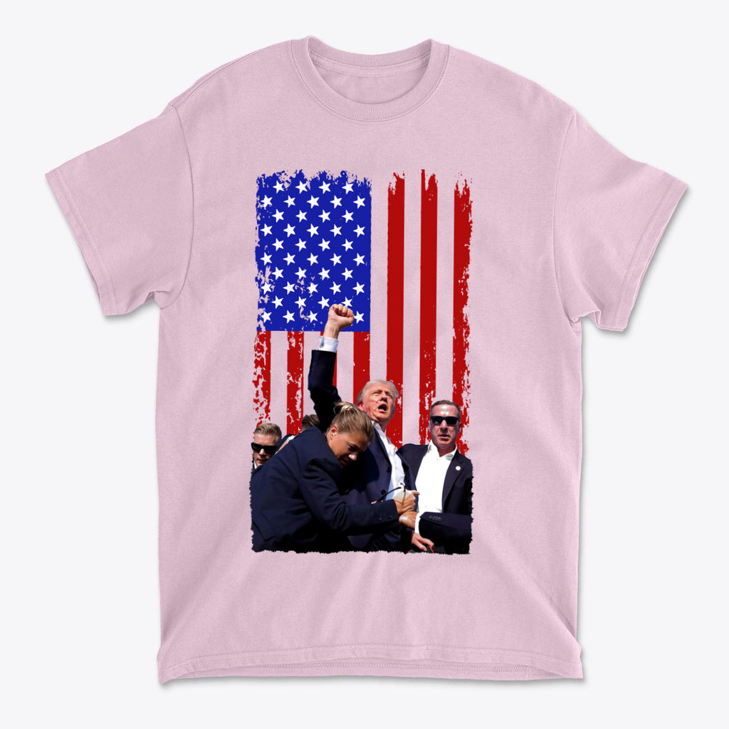 Trump Shot American Flag Design on a pink t-shirt featuring a patriotic design with an American flag background.