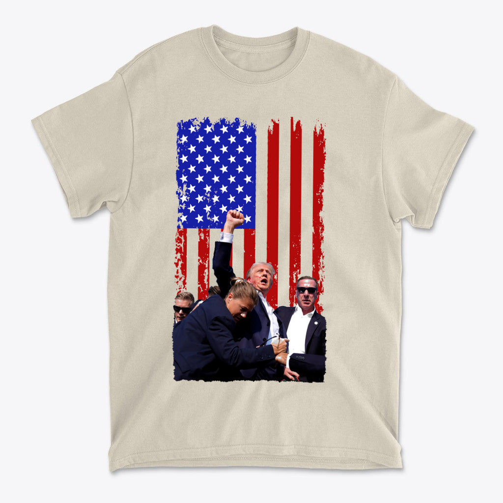 Trump Shot American Flag Design t-shirt featuring bold American flag background and iconic gesture.