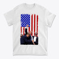 Trump Shot American Flag Design t-shirt featuring patriotic graphics and a strong American flag background.