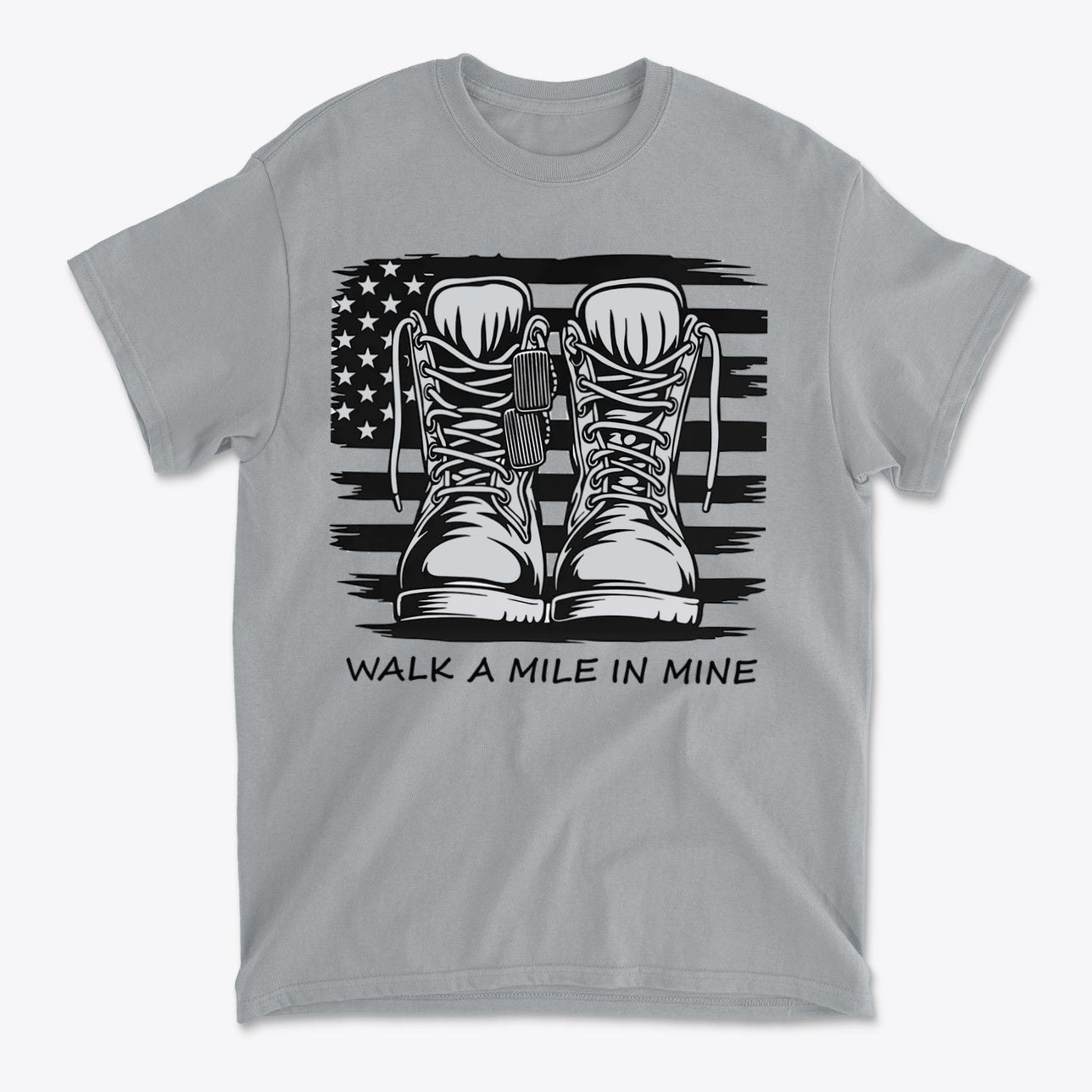 Walk A Mile In Mine Apparel Art featuring military boots on a grey t-shirt with an American flag design.
