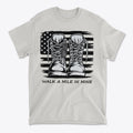 Walk A Mile In Mine Apparel Art t-shirt with boots design and American flag background