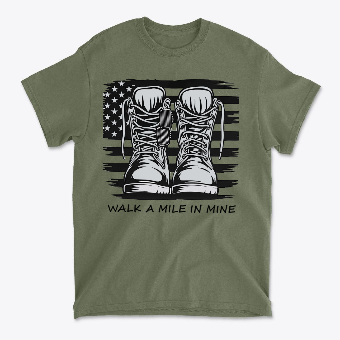 Walk A Mile In Mine Apparel Art featuring combat boots on an olive green shirt with a flag background.