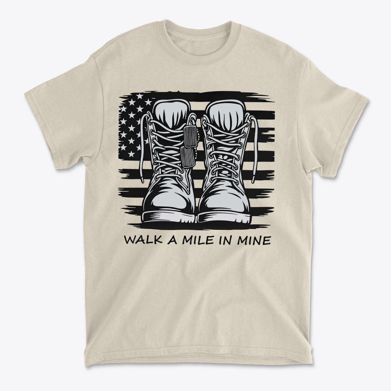 Walk A Mile In Mine Apparel Art featuring boots and an American flag design on a beige shirt.