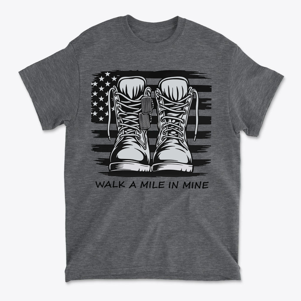 Walk A Mile In Mine Apparel Art featuring combat boots on a gray t-shirt with American flag background.