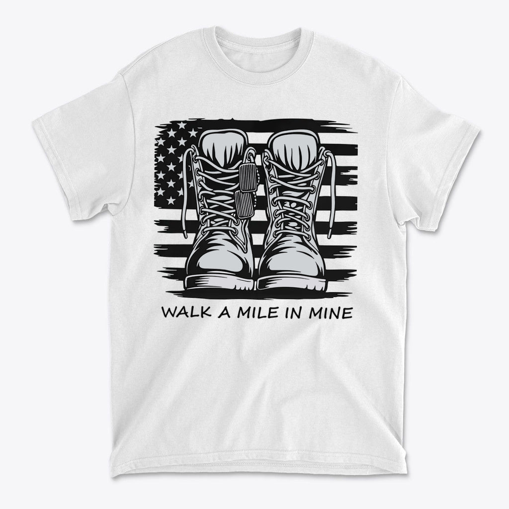 Walk A Mile In Mine Apparel Art featuring military boots and an American flag design on a white t-shirt.
