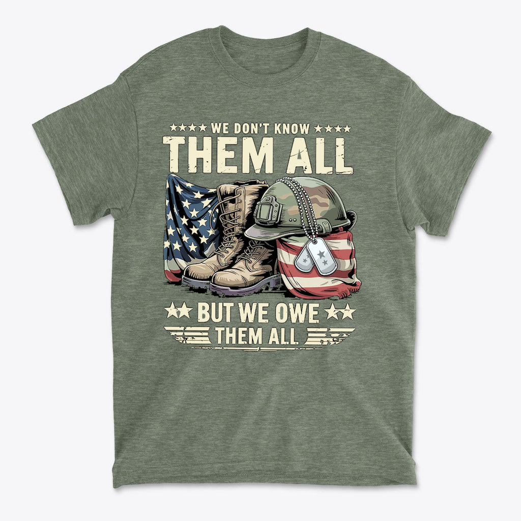 Graphic t-shirt featuring the phrase 'We Don't Know Them All But We Owe Them All' with military boots and American flag.