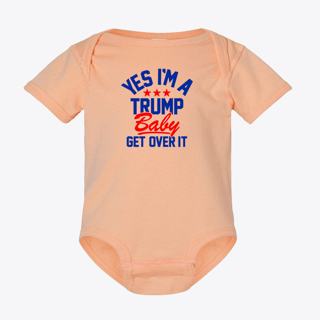 Yes I am A Trump Baby Bodysuit Art in peach color with bold text design.