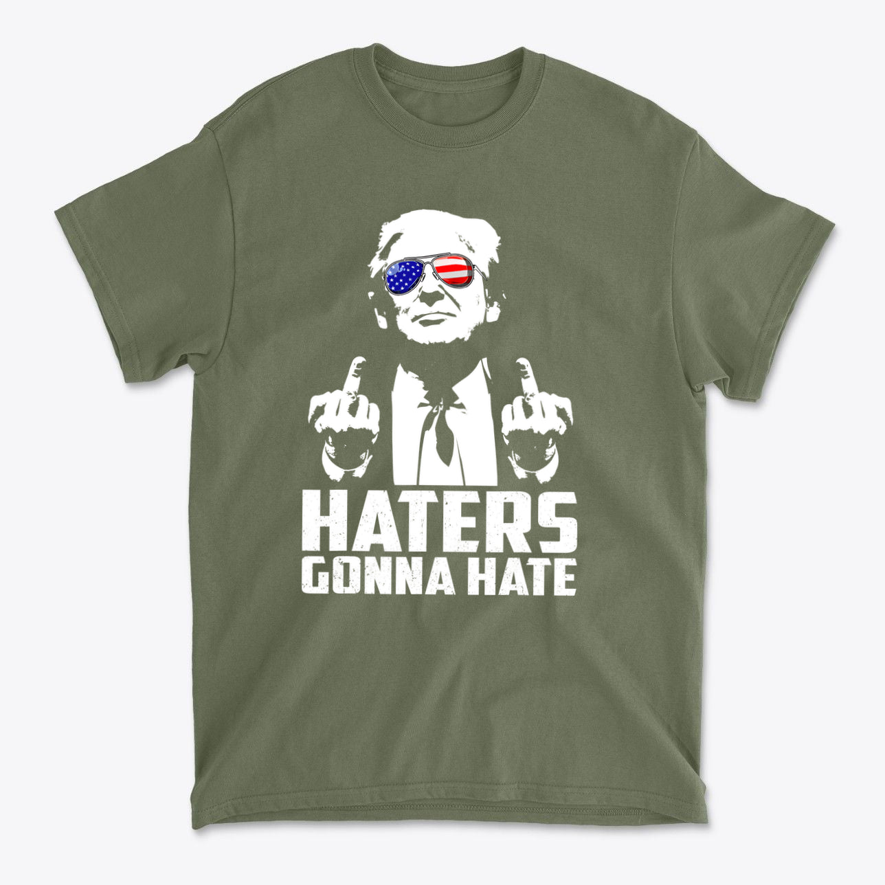 Haters Gonna Hate Graphic Design on an olive green t-shirt featuring a graphic of a confident figure with American flag sunglasses.