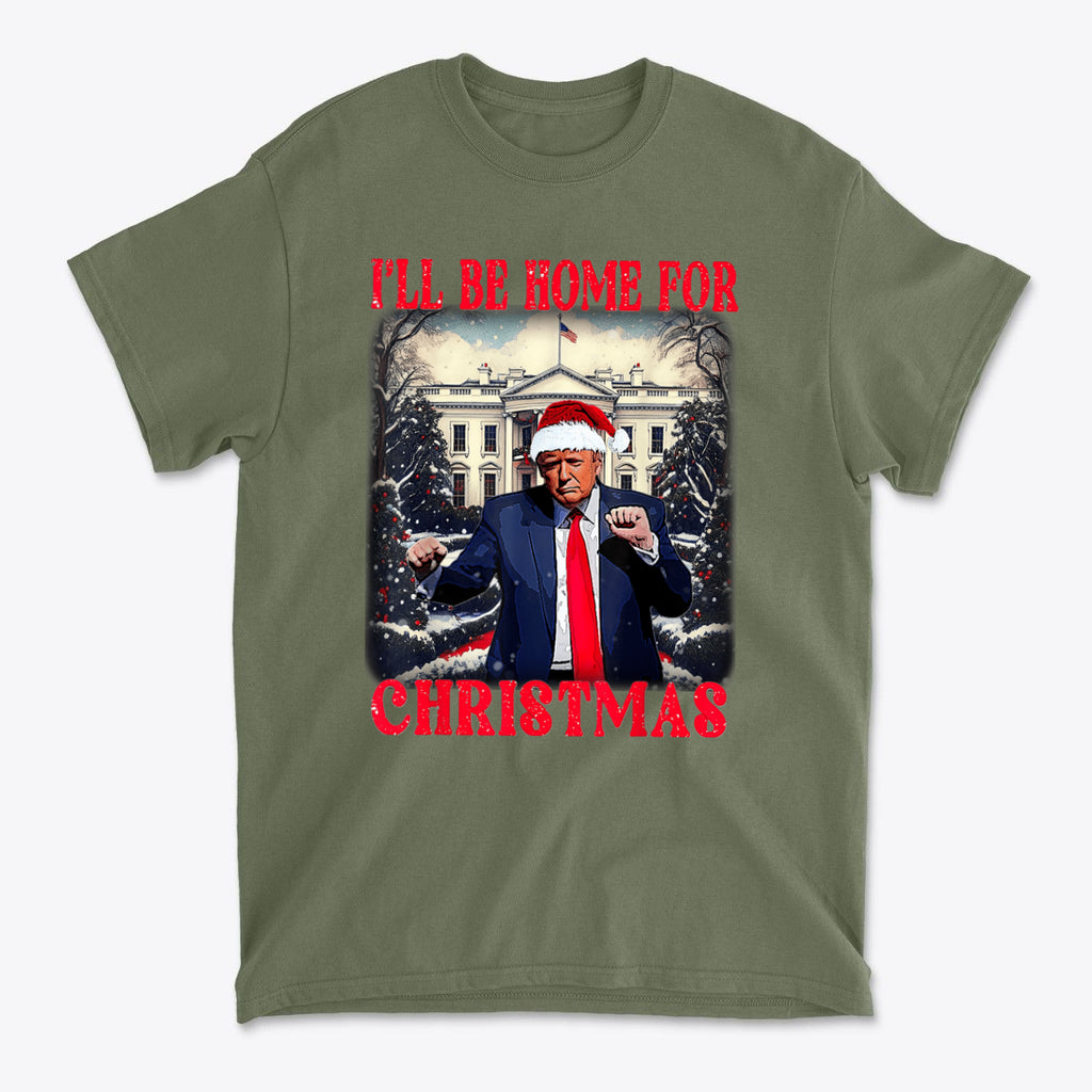 Trump Dancing I'll Be Home For Christmas graphic t-shirt featuring Trump in Santa hat and festive design.