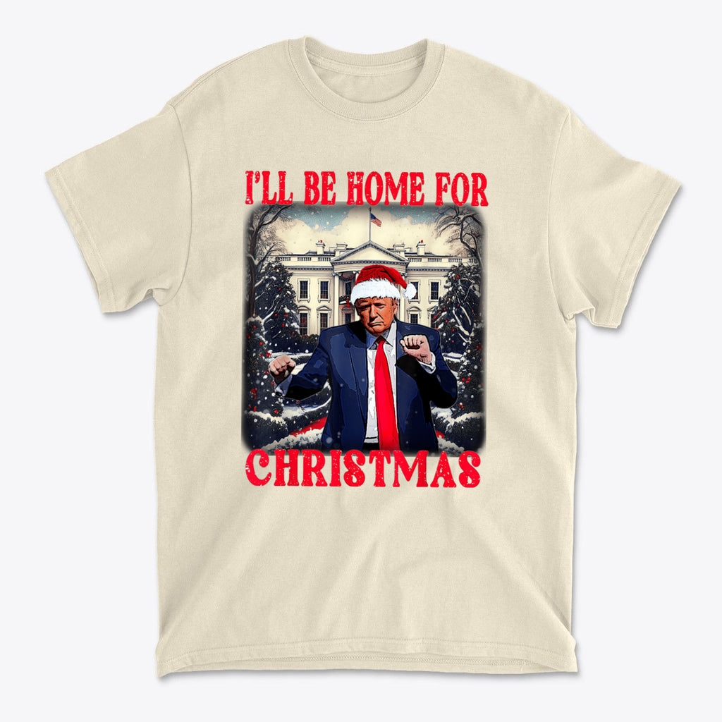 Trump Dancing Be Home For Christmas Graphic Tee featuring festive design with Trump in Santa hat.