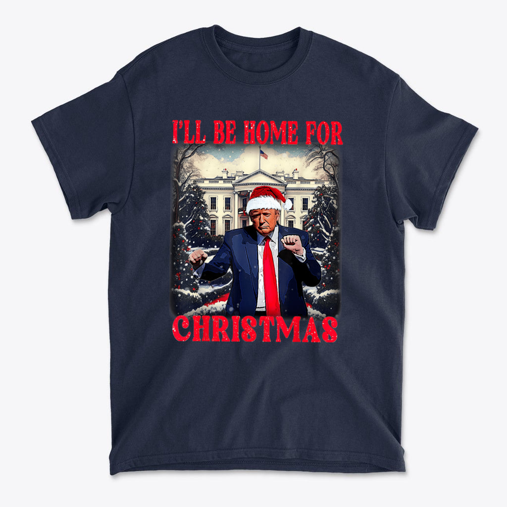 Trump Dancing I'll Be Home For Christmas graphic t-shirt featuring Trump in a Santa hat with the White House backdrop.