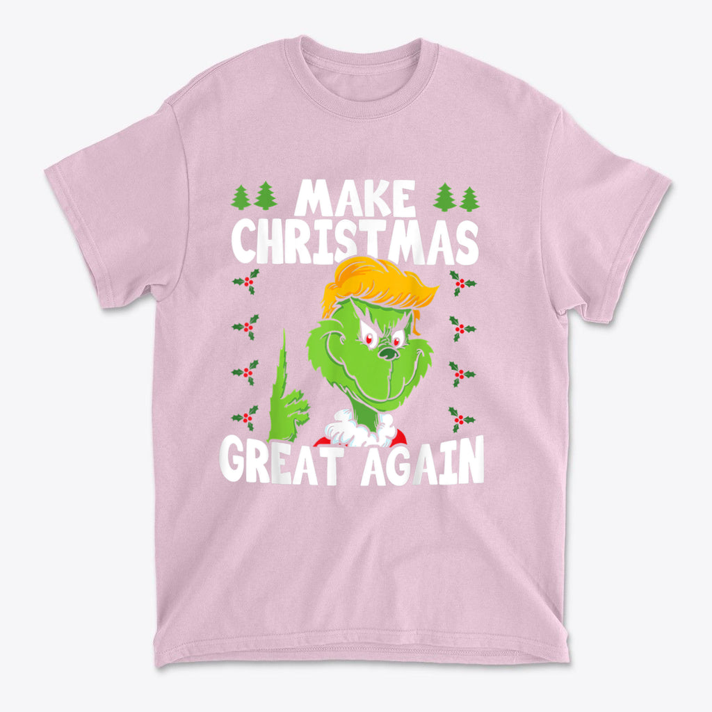 Make Christmas Great Again With The Grinch graphic t-shirt in pink featuring a cartoon Grinch design.