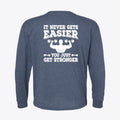 Back view of a blue long-sleeve graphic tee that says It Never Gets Easier You Just Get Stronger.