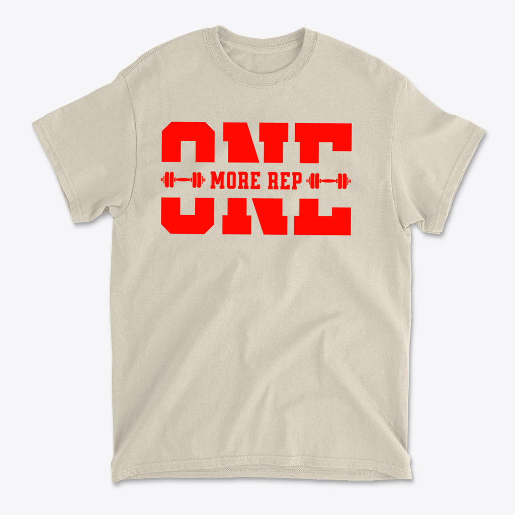 Always Push For One More Rep Now graphic tee in beige with bold red lettering.