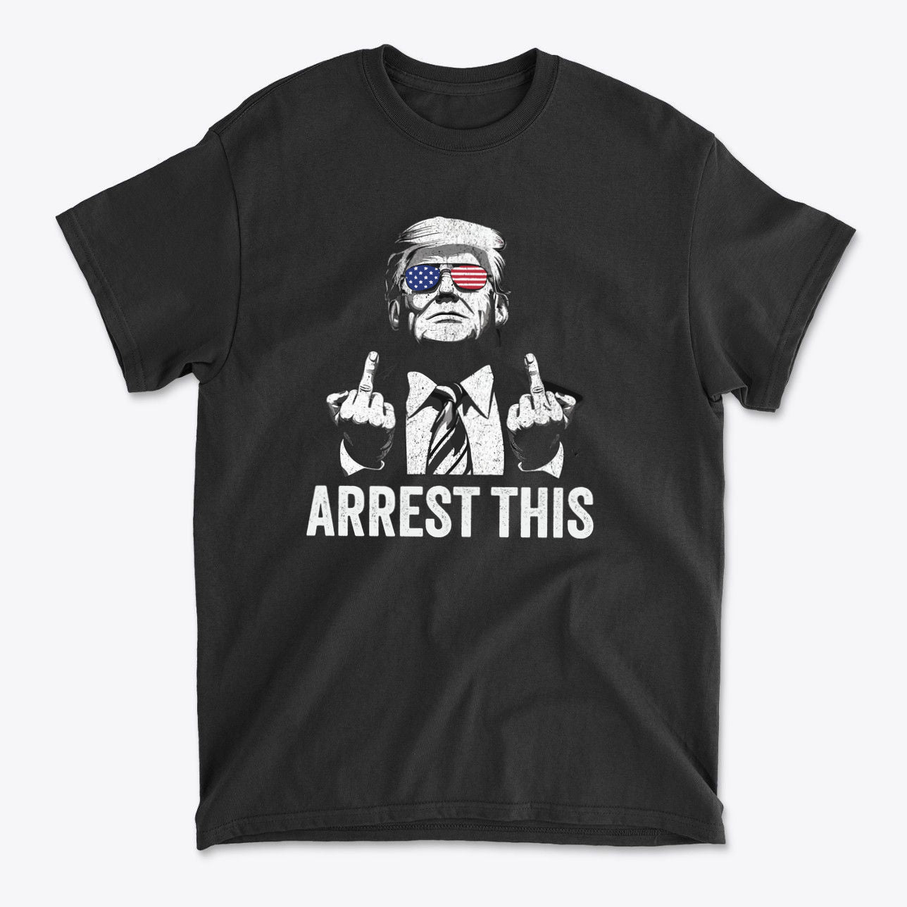 Graphic tee featuring a figure with sunglasses and text 'ARREST THIS', related to 'Why They Want To Arrest This Now' message.