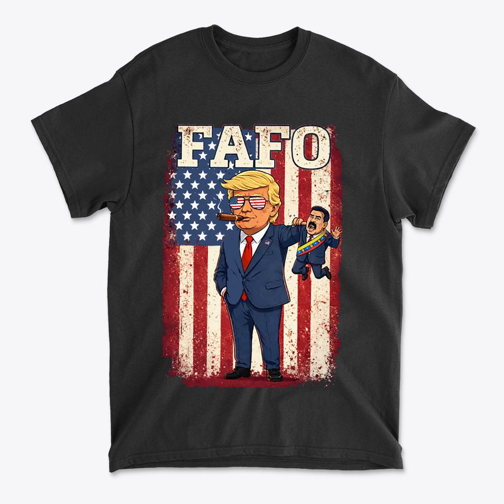 Trump Captures Maduro FAFO Now graphic t-shirt featuring cartoon Trump against an American flag background.