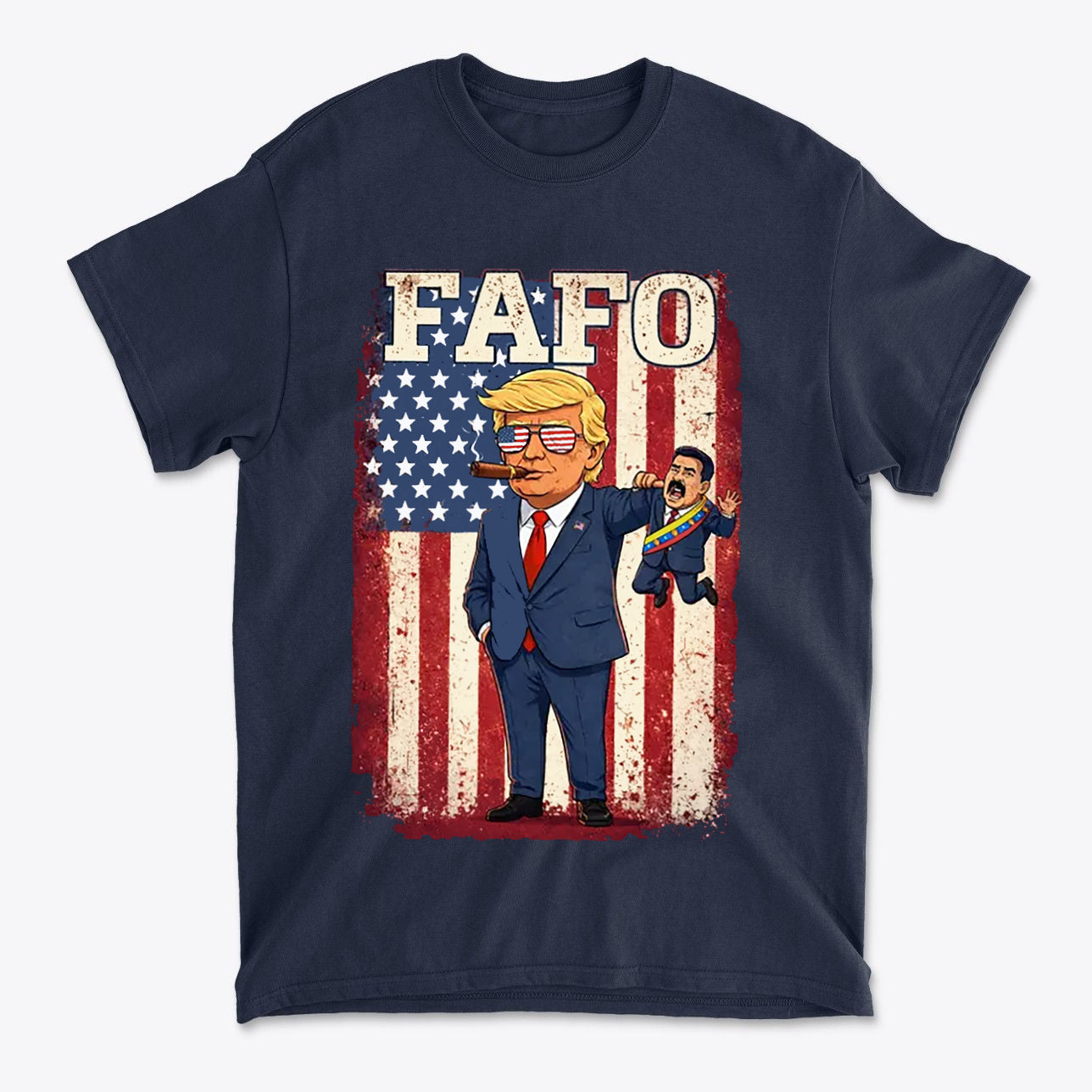 Trump Captures Maduro FAFO Now graphic tee featuring cartoon Trump with American flag background.