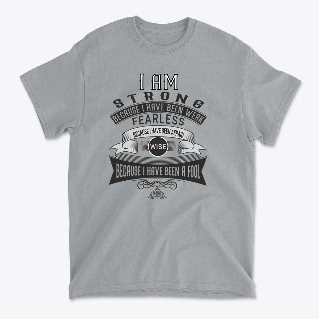 Strength Born From Past Weakness graphic t-shirt with inspiring message about strength and resilience.