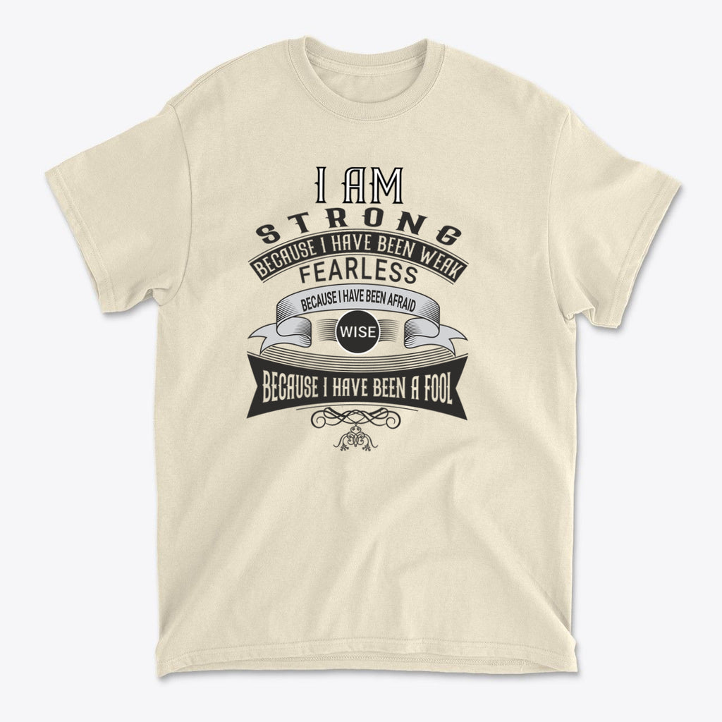 Strength Born From Past Weakness graphic tee in beige, featuring a motivational quote about strength and wisdom.