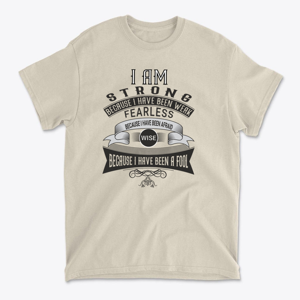 Strength Born From Past Weakness graphic t-shirt featuring inspiring typography in a light color.