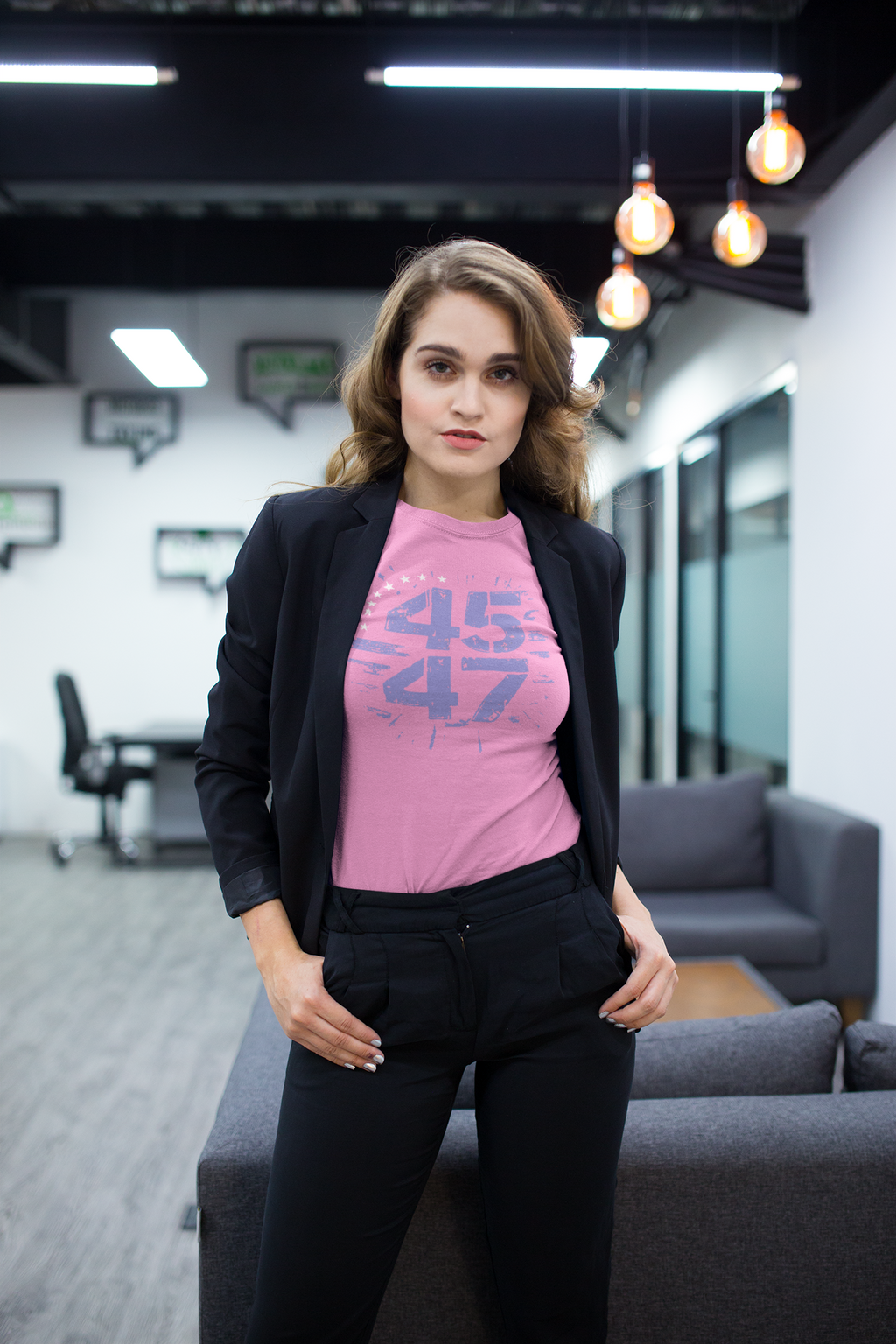 Model wearing The 45 47 Stars Graphic Design graphic tee paired with a blazer in a modern office setting.