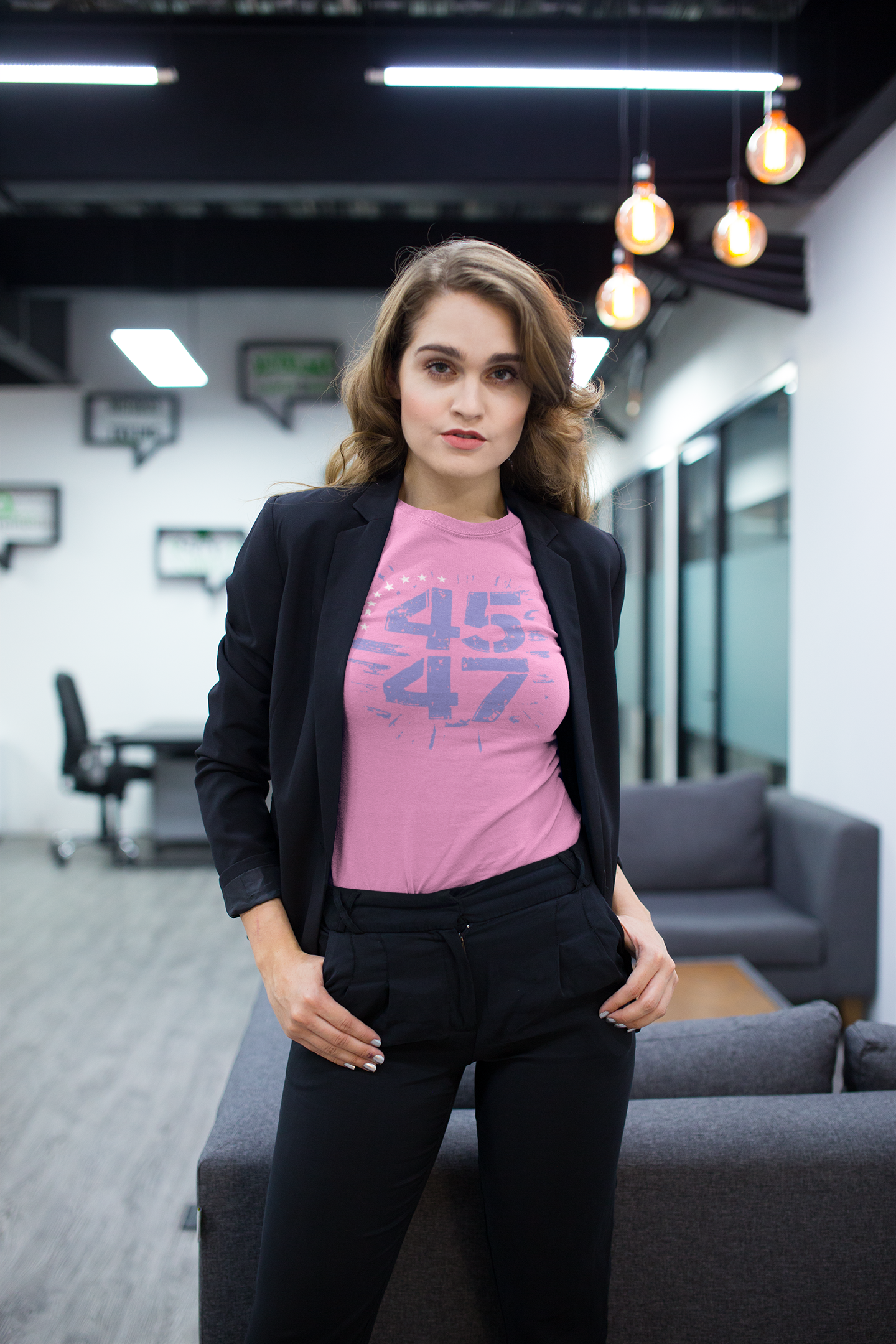 Model wearing The 45 47 Stars Graphic Design graphic tee paired with a blazer in a modern office setting.