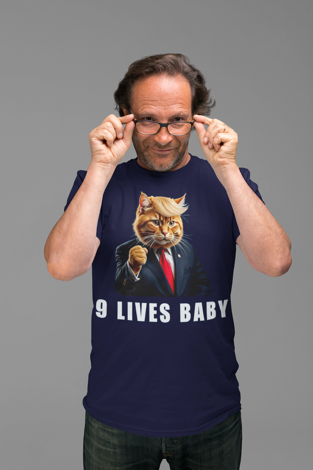 Man wearing a Nine Lives Baby Fist Art Style shirt featuring a cat in a suit.