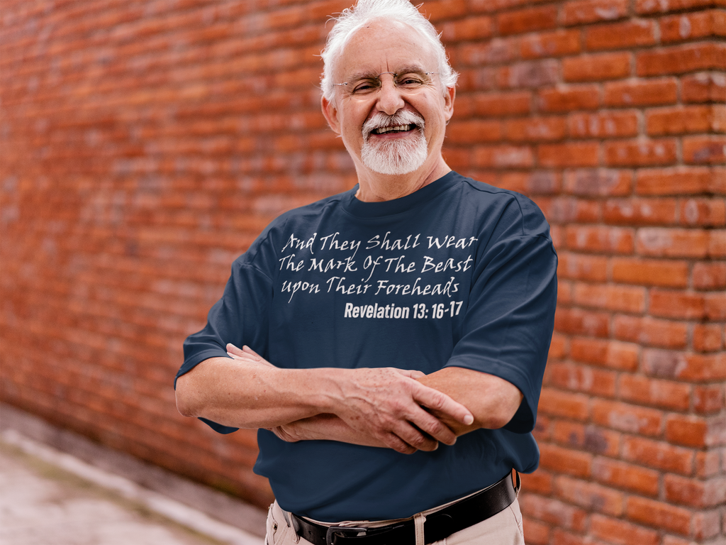Man wearing a graphic tee that says 'The Mark Of The Beast Revealed' in an urban setting.